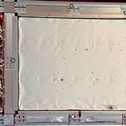 A close-up view of a panel from the Long Duration Exposure Facility (LDEF) spacecraft. Credit: NASA JSC.