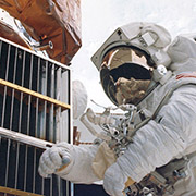 Solar Max satellite repair. Several metal louvers and thermal blankets were returned 
									from the Solar Max satellite. Returned surfaces are a source of information on sub-millimeter 
									sized orbital debris. Credit: NASA.