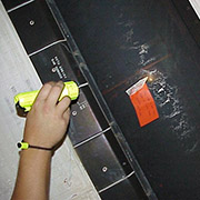 STS-092 vertical stabilizer damage from orbital debris. Credit: NASA.