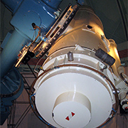 The Michigan Orbital Debris Survey Telescope (MODEST). This telescope is located outside 
									of La Serena, Chile at the Cerro Tololo Inter-American Observatory. The telescope is a 0.61/0.91 m 
									f/3.5 Schmidt of classical design and is used for observations of the geosynchronous orbit regime. 
									Observations are taken in two-week segments surrounding the new moon. Credit: Patrick Seitzer, 
									Unversity of Michigan.